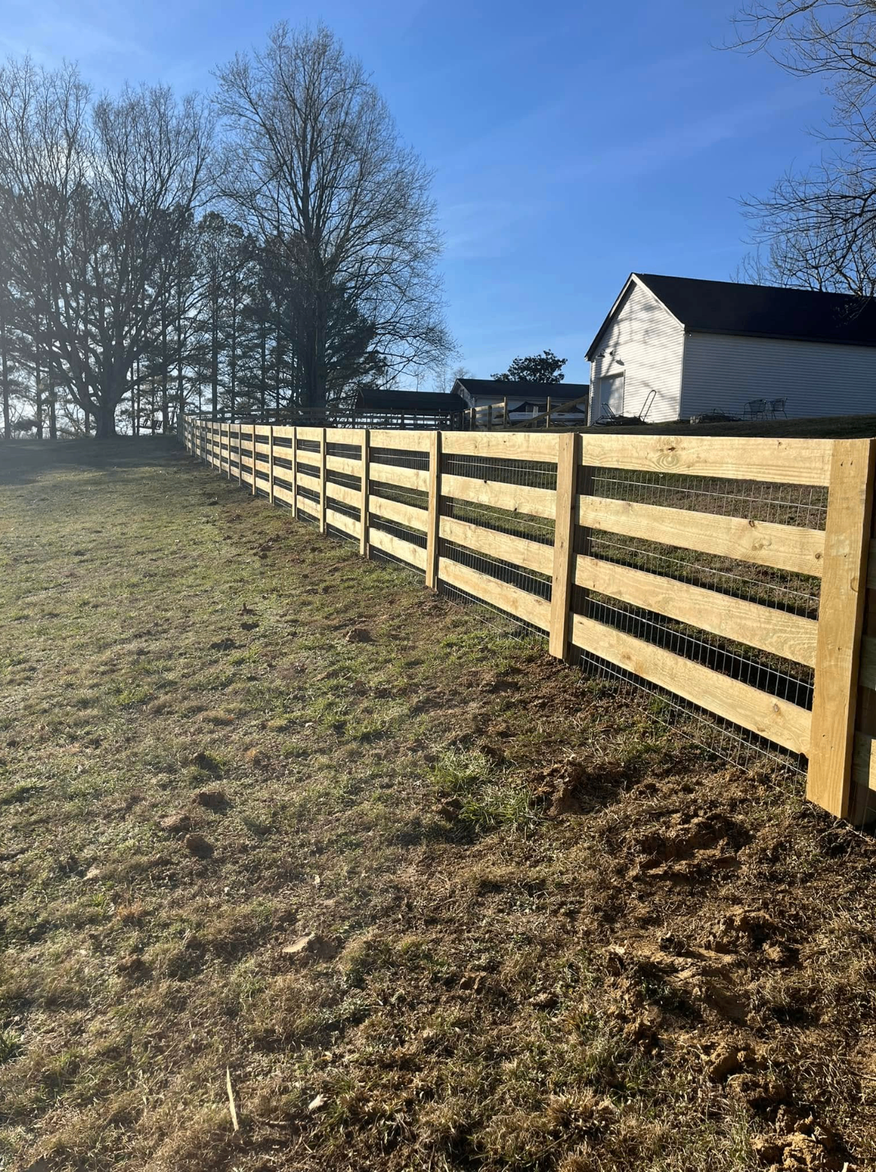 Custom wood board fence on Tennessee property